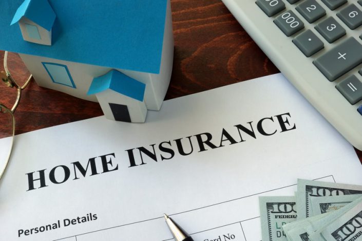 Home insurance form and dollars on the table. insurance attorney